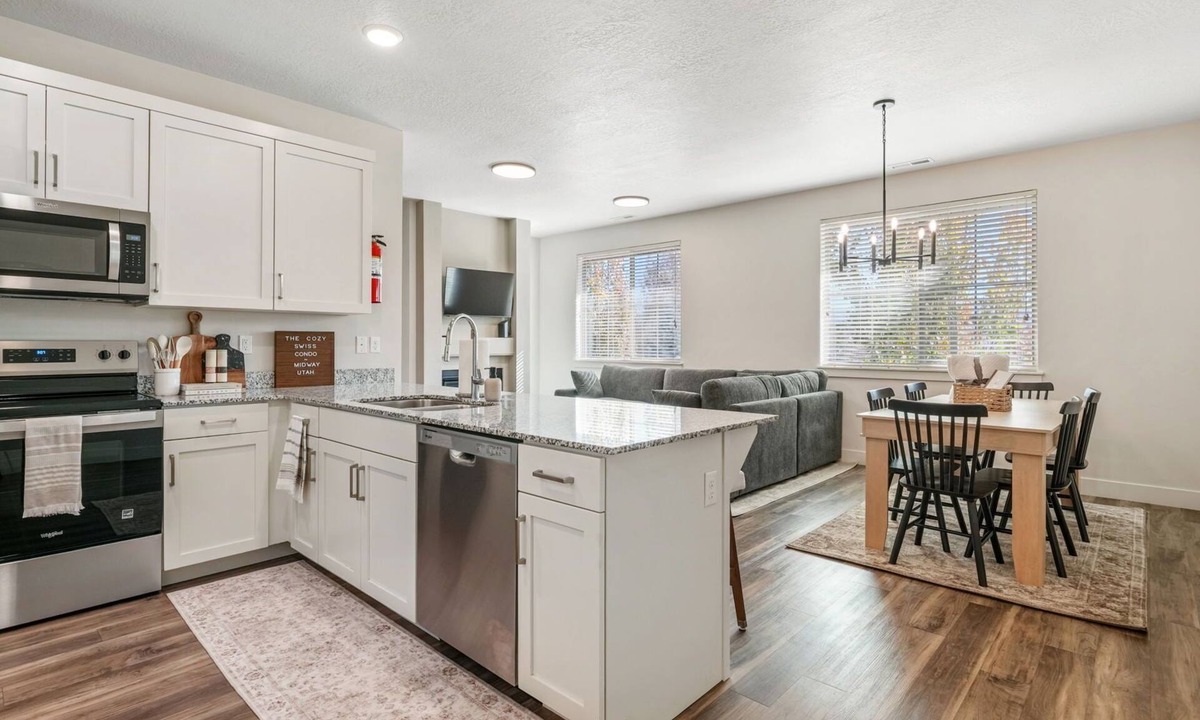 Midway Condo | Cozy Swiss Condo - King Bed, Sleeps 6, Free Blanket