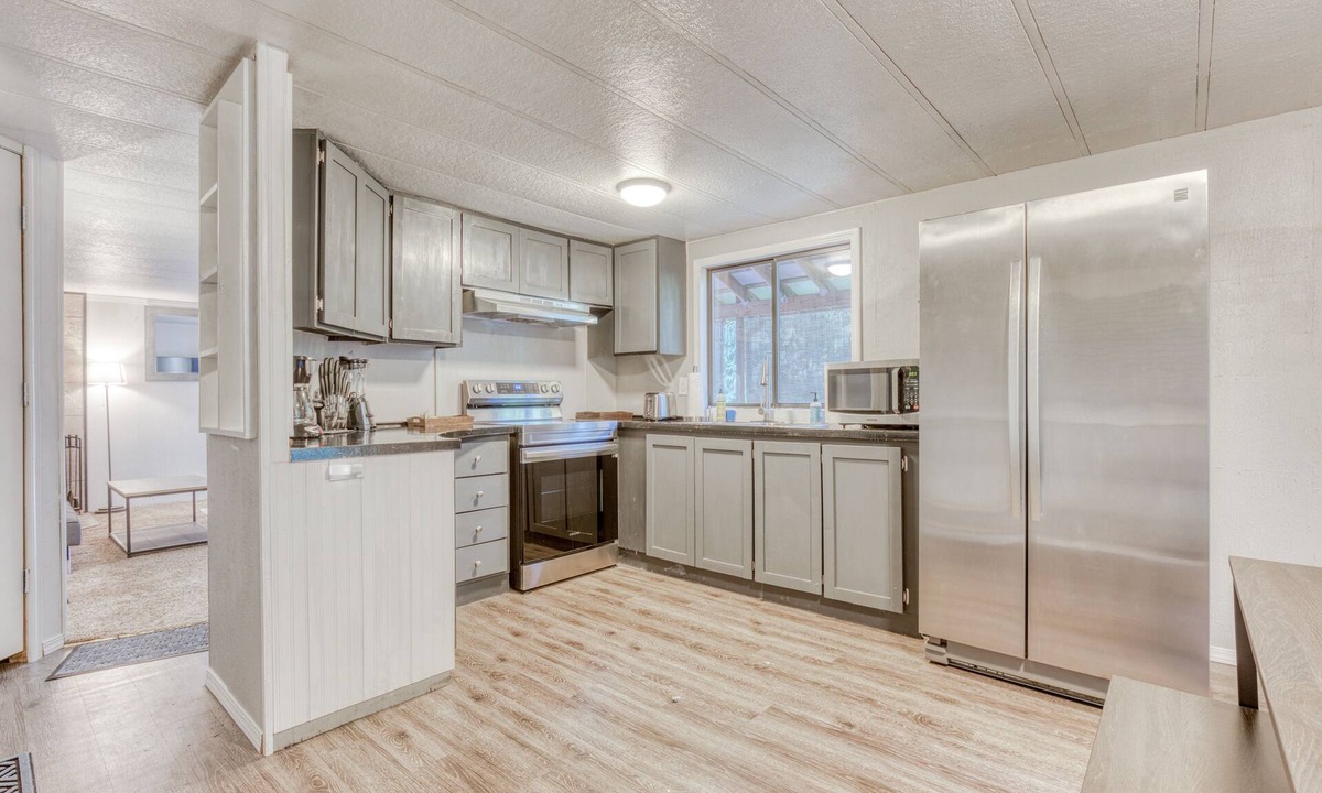Sandy House | Serene home with large outdoor deck, beautiful forest views, firepit & gas grill
