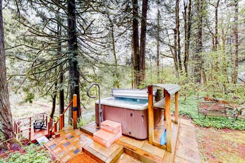 Marmot Apartment | Unwind in nature's embrace at a 1925 cabin with hot tub & river views