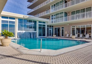 Beachfront 10th-floor condo with Gulf view, pool, gym, & balcony