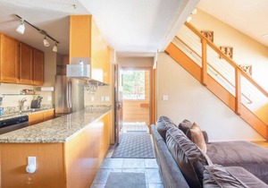 Located near the Village and can sleep a crowd! Year round hot tub near condo