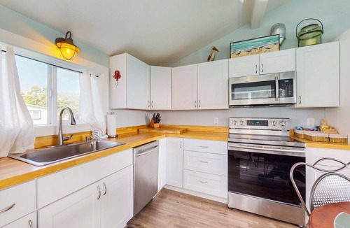 Port Orford House | Adorable, nautical-themed home with a private hot tub & ocean views