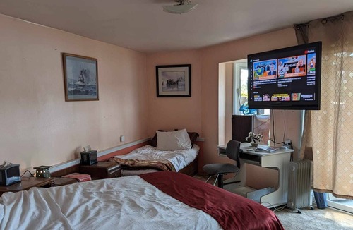 Marrowstone Cabin | Bed and a twin bed, bedroom individual, entrance and exit to private beach