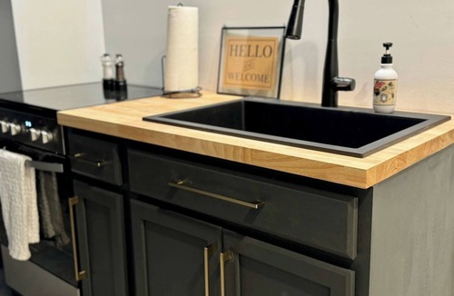 Belmont Historic District Apartment | Belmont Millside Studio—Warm Industrial & Chic