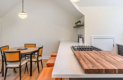 Uptown Apartment | Central city apartment with mountain-views, fireplace, & private washer/dryer