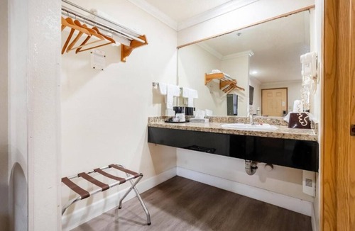 Corcoran Hotel | Charming Room with Private Bath & TV, Close to Parks & Popular Attractions