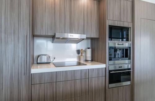 East Village Condo | Cityscape Elegance with Water Views