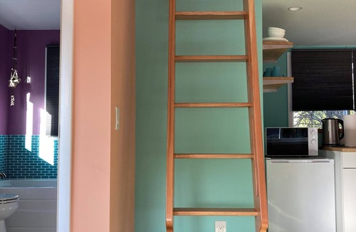 Alabama Hill Apartment | Colorful upstairs studio with lofted bed and soaking tub