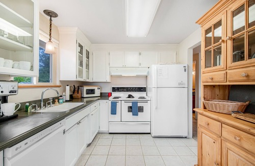 University Place House | Comfortable home with Puget Sound view, decks, garden patio, WiFi & W/D