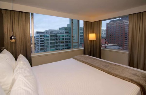 Downtown Portland Hotel | Elegant Corner Penthouse Suite | King Bed + Skyline Views