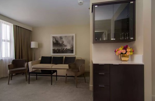 Downtown Portland Hotel | Elegant Corner Penthouse Suite | King Bed + Skyline Views