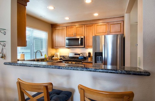 West Newport Condo | Enjoy Ocean Views from the Large Roof-Top Deck Adjacent to the Newport Pier!