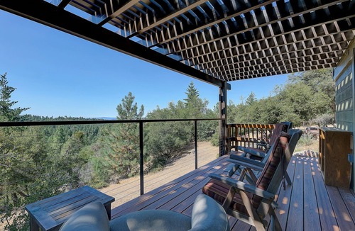 Idyllwild Cabin | Few properties in Idyllwild have a location as majestic and pristine as the Six Acre Sanctuary. Originally a girl scout camp, the land sits atop Idyllwild with beautiful views of Tahquitz Peak on one side and ocean views on the other.