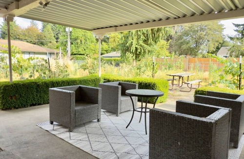 Lacey House | Fully fenced and gated two bedroom home that easily accommodates four guests. Featuring a large covered private patio for year round enjoyment and relaxation. Fully equipped kitchen and laundry with full size washer/dryer. Lots on parking on site.