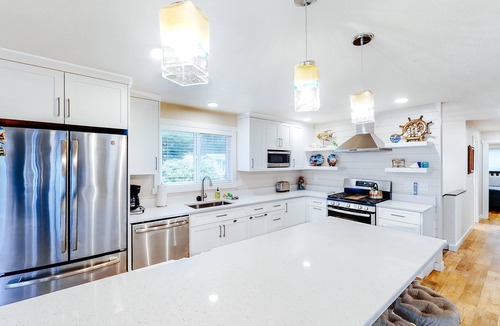 Lincoln Beach House | Homey dog friendly house with partial ocean views gas fireplaces and gas grill
