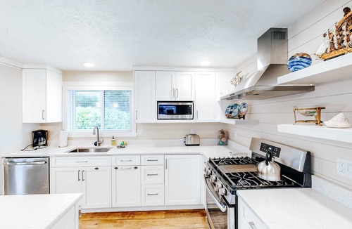 Lincoln Beach House | Homey dog friendly house with partial ocean views gas fireplaces and gas grill