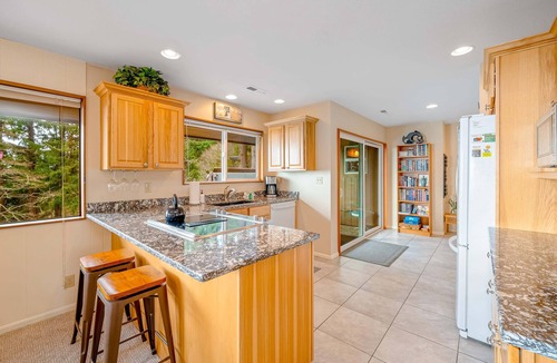 Neahkahnie Beach House | Inviting home with spectacular view, hot tub, balcony, fireplace, & W&D