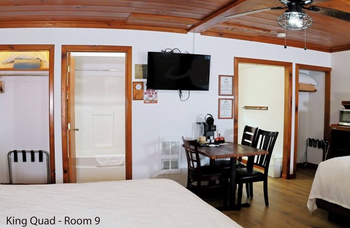 Florence Hotel | King Quad Rooms: Double King Beds & Rustic Woods Comfort for 5!