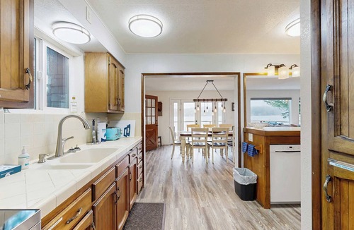 Dunes City House | Lakefront dream with private hot tub, dock, kayaks, pedal boat & amazing views
