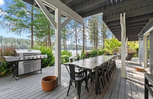 Nine Mile Falls House | Luxe Lake Home Hot Tub Private Dock Beach