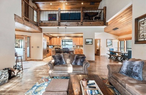 Shaver Lake House | Luxury Shaver Lake retreat with pond views, soaring wood ceilings, a stone fireplace, gourmet kitchen, four bedrooms, a loft, spacious backyard, and a brand-new spa. Perfect for families and groups seeking a mountain getaway.
