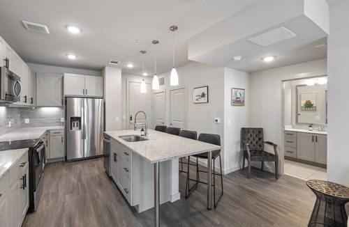Windsor Park Apartment | Modern 2BR Poolside Patio Suite in North Austin