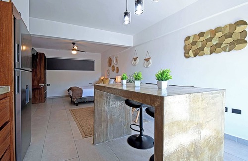 La Paz Apartment | New apartment with communal pool, steps from beach