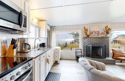Netarts House | Quaint oceanfront hideaway with open layout fireplace central AC and gas grill