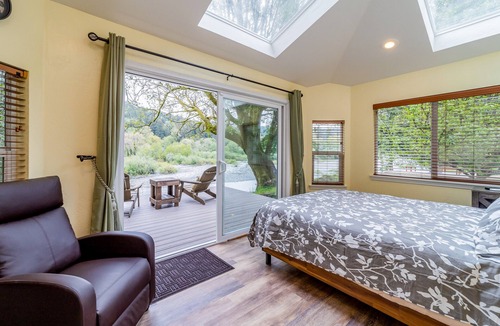 Crescent City House | Secluded riverfront getaway with firepit, deck, washer/dryer, & free WiFi
