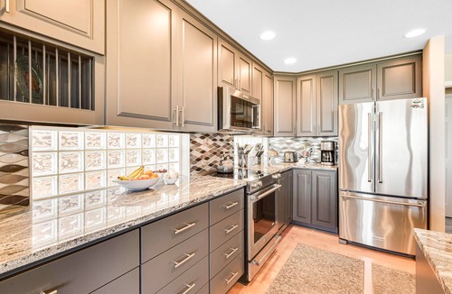 Freeland House | Two-story, bay front retreat with a deck, direct beach access, and washer/dryer