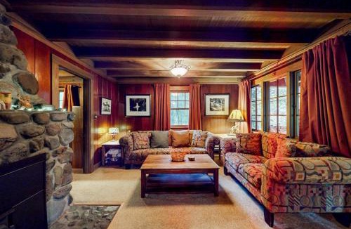 Marmot Apartment | Unwind in nature's embrace at a 1925 cabin with hot tub & river views