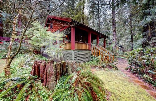 Marmot Apartment | Unwind in nature's embrace at a 1925 cabin with hot tub & river views