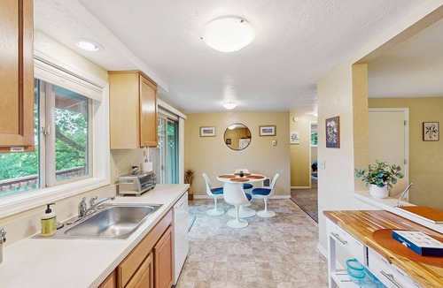 Friendly Condo | Upper level of duplex with a large deck & mountain view - dog friendly for 1 dog