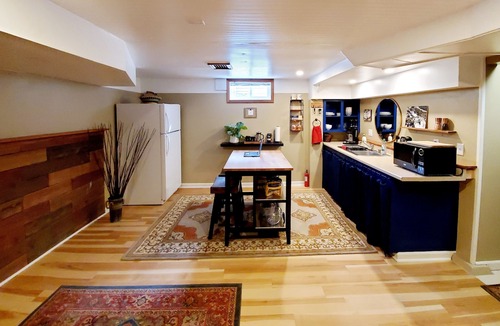 Concordia House | Well appointed basement guest suite with private entrance & backyard oasis.