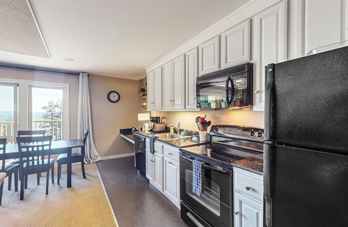 Rosario Condo | Wonderful escape with water access, three balconies, W/D, & gas fireplace