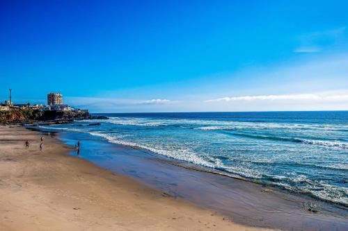Airy, Beach-View Dog-Friendly Villa with Patio, Outdoor Pool, Streaming, AC