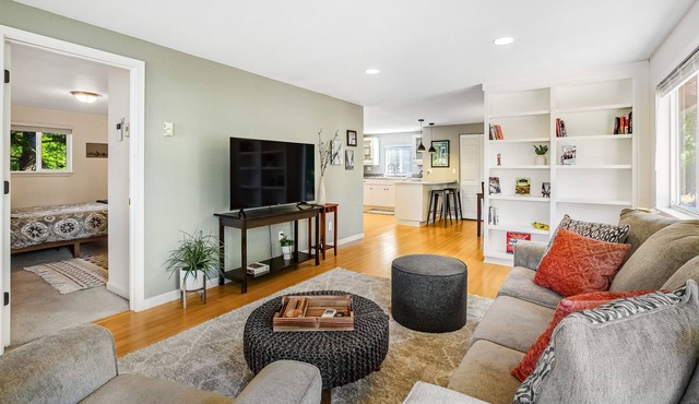 Beautifully updated home with enclosed yard, deck, WiFi, & W/D - near everything