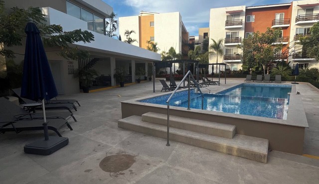 Comfortable apartment with a pool and hot tub.