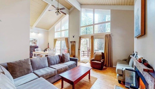 Dog-friendly cabin surrounded by trees and wildlife with fireplace & deck