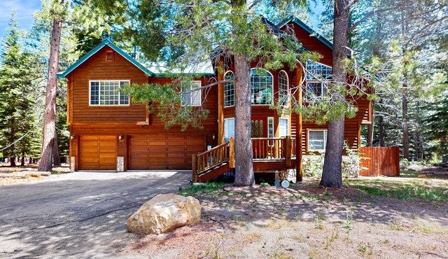 Upscale house with 2 living areas, open layout, hot tub, backyard, & luxe suite
